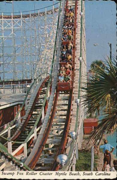 People riding the Swamp Fox in family kingdom 