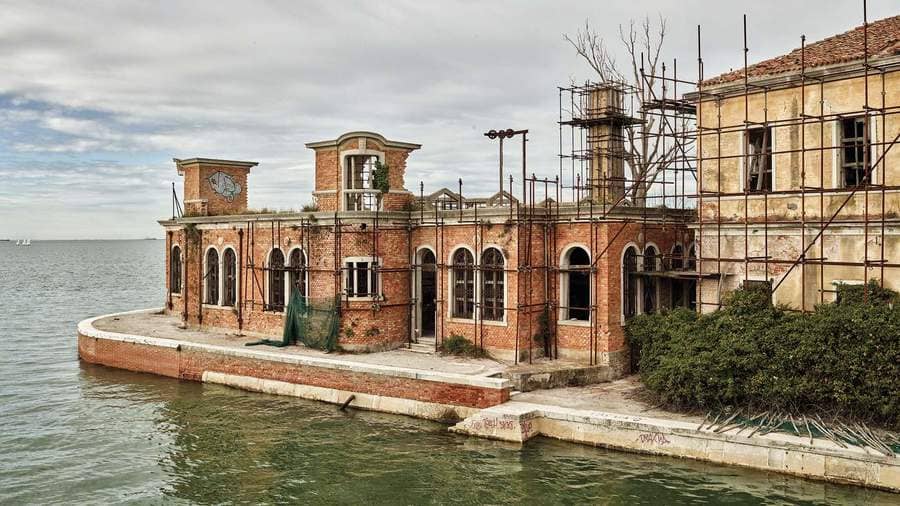 Outside the hospital building now ruins, which remain abandoned on the island of Poveglia