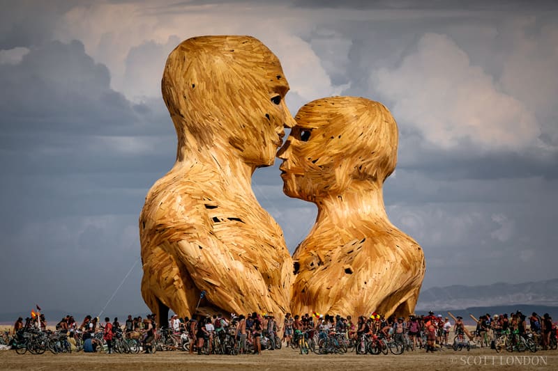 Sculpted couple surrounded by people