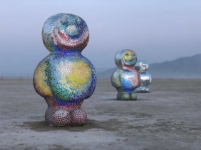 Three colorful sculptures on the beach 
