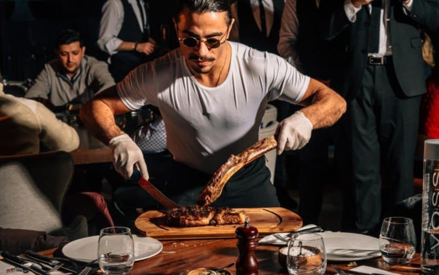 Turkish chef Nusret Gokce performing his signature carving technique at his Nusr-Et Steakhouse in Manhattan.