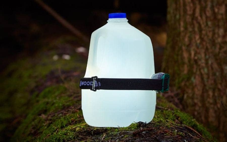 A large plastic bottle with a headlamp attached to the outside, creating a 'lantern effect.'