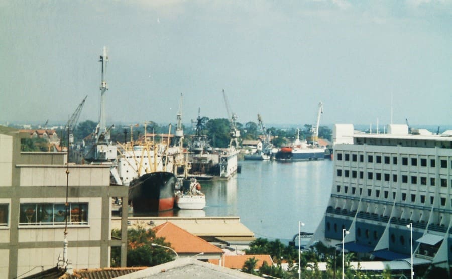 A view of the floating hotel docked up on a coastal line 