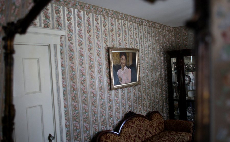 A portrait of Lizzie Borden hangs on a wall of the house.
